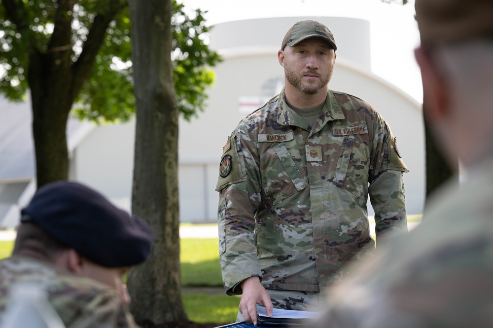 181st Security Forces Squadron attend a professional development briefing at the National Museum of the US Air Force