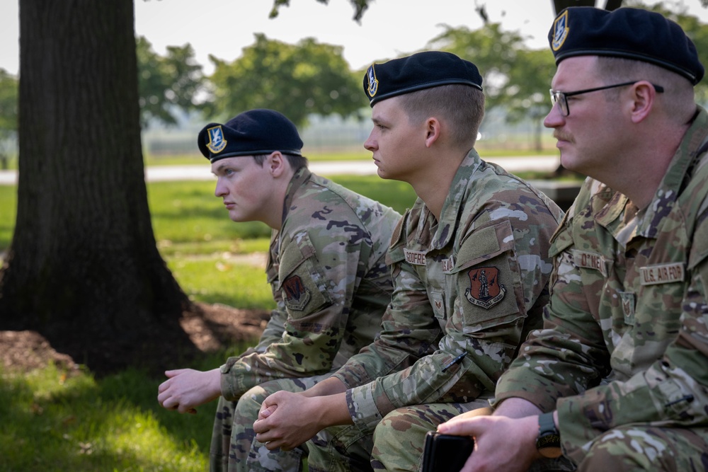 181st Security Forces Squadron attend a professional development briefing at the National Museum of the US Air Force