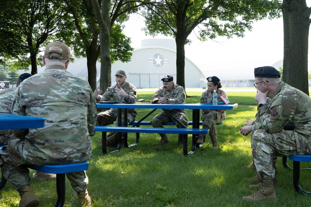 181st Security Forces Squadron attend a professional development briefing at the National Museum of the US Air Force