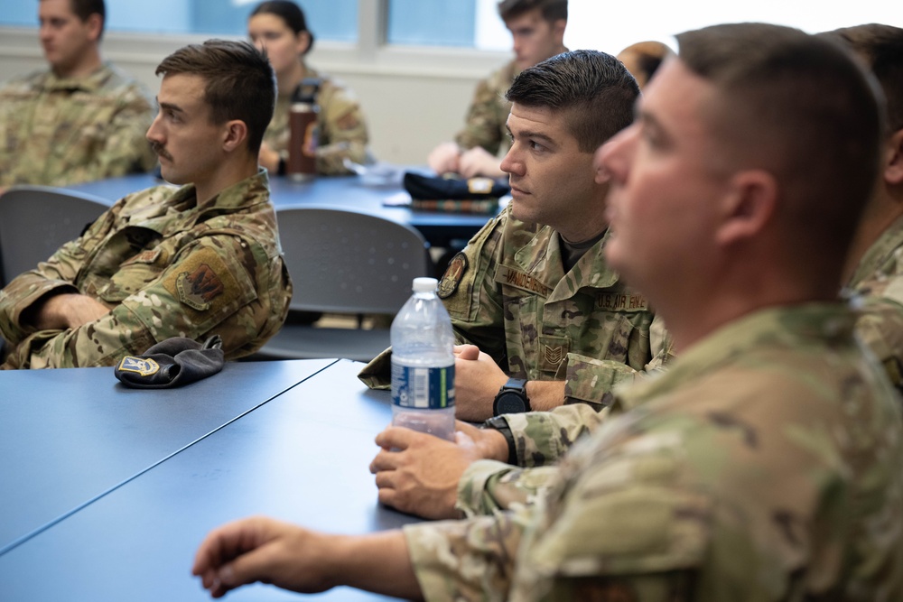 181st Security Forces Squadron attend a professional development briefing at the National Museum of the US Air Force