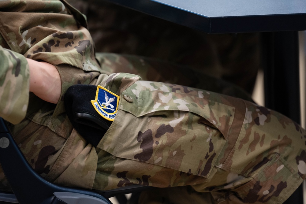 181st Security Forces Squadron attend a professional development briefing at the National Museum of the US Air Force