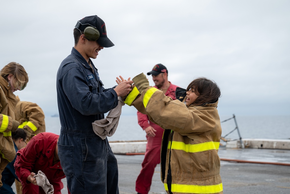 Family, friends and midshipmen embark USS Somerset for Tiger Cruise
