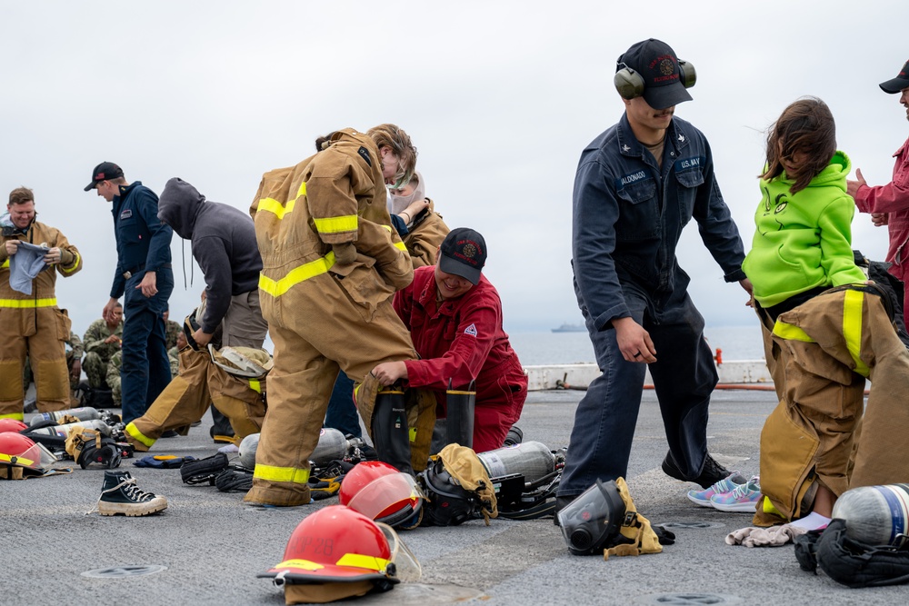 Family, friends and midshipmen embark USS Somerset for Tiger Cruise