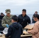Family, friends and midshipmen embark USS Somerset for Tiger Cruise