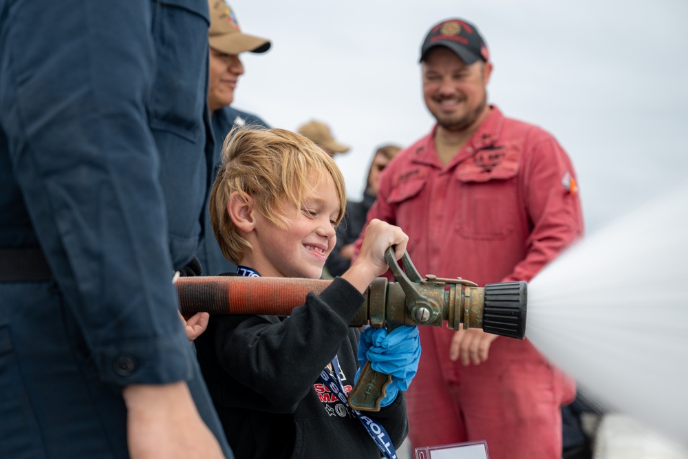 Family, friends and midshipmen embark USS Somerset for Tiger Cruise