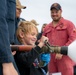 Family, friends and midshipmen embark USS Somerset for Tiger Cruise