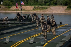 U.S. and Romanian soldiers Conduct Wet Gap Crossing during Saber Guardian 25 [Image 1 of 7]