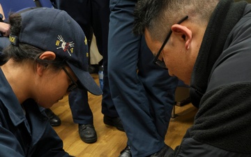 SA Terriejanniene NG and HM3 Timothy Efendy conduct Tactical Combat Casualty Care training