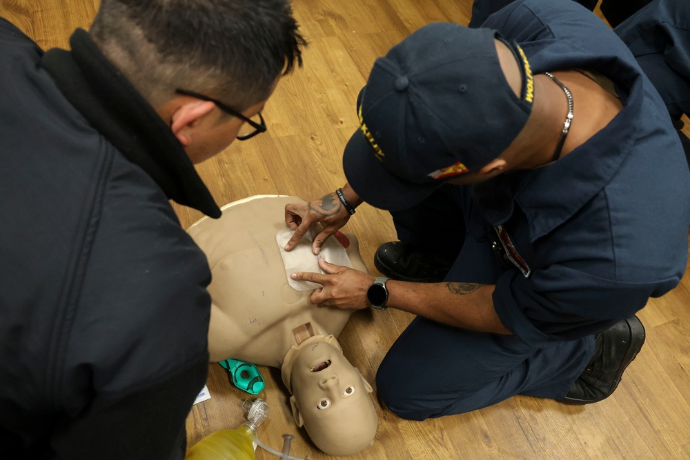 HM3 Timothy Efendy and LSSA David Simmons conduct Tactical Combat Casualty Care training