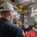 YN1 Joshua Kelley provides instruction to fellow crew members during a simulated medical casualty