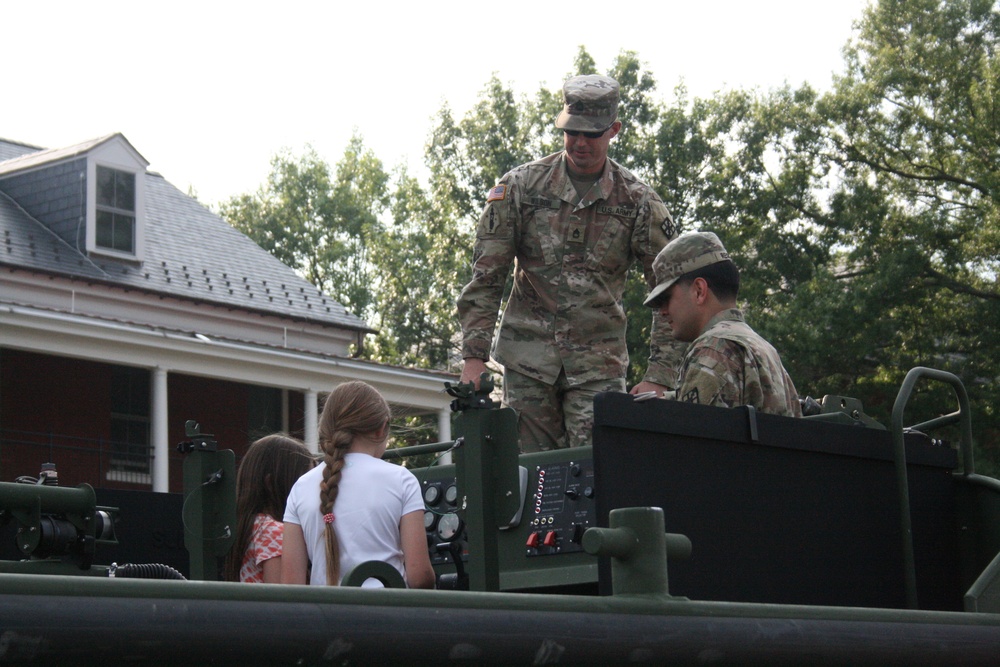 Engineers from the 412th Theater Engineer Command provide equipment displays at the Twilight Tattoo