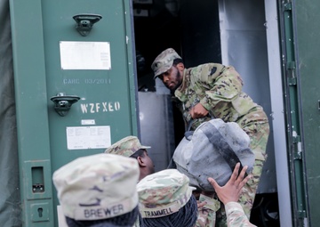 District of Columbia National Guard  Culinary Specialist team up with Pennsylvania National Guard  to work on Containerized Kitchen