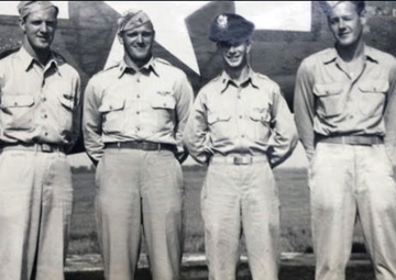 Staff Sgt. Loring E. Lord (far left) stands with fellow crew members