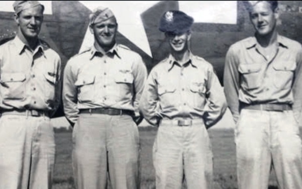 Staff Sgt. Loring E. Lord (far left) stands with fellow crew members