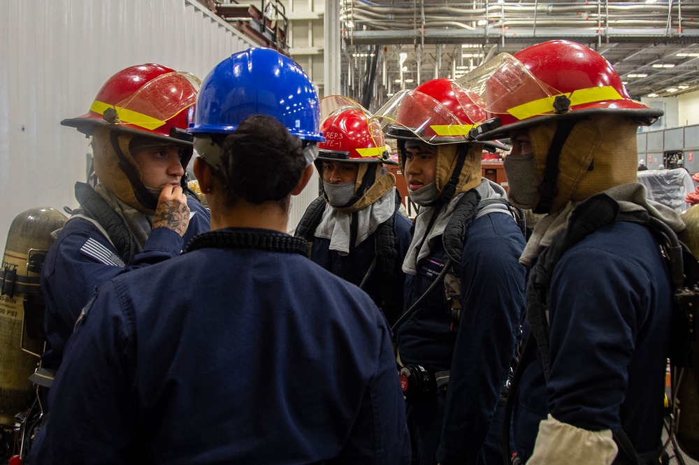 Sailors participate in a general quarters drill aboard USS Ronald Reagan (CVN 76)
