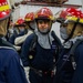 Sailors participate in a general quarters drill aboard USS Ronald Reagan (CVN 76)