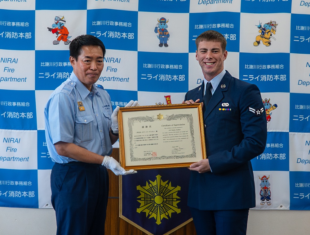 Through the fire: 18th MUNS Airmen save local national