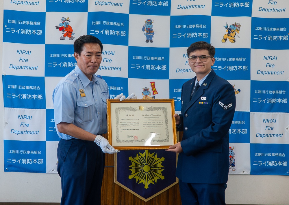 Through the fire: 18th MUNS Airmen save local national