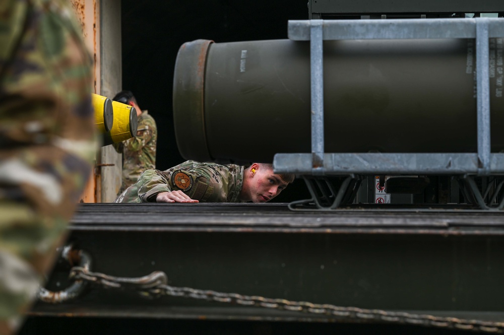 Through the fire: 18th MUNS Airmen save local national