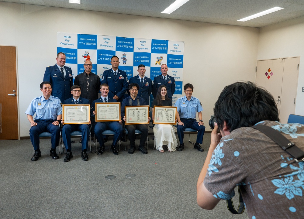 Through the fire: 18th MUNS Airmen save local national