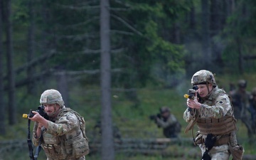 Michigan Army National Guard soldiers assault trenches at Exercise Baltic Viking