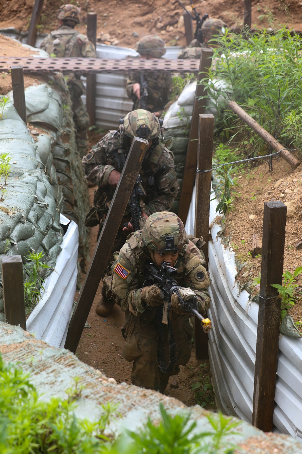 Michigan Army National Guard soldiers assault trenches at Exercise Baltic Viking