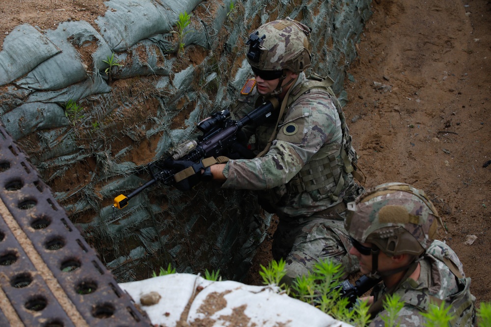 Michigan Army National Guard soldiers assault trenches at Exercise Baltic Viking