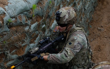 Michigan Army National Guard soldiers assault trenches at Exercise Baltic Viking