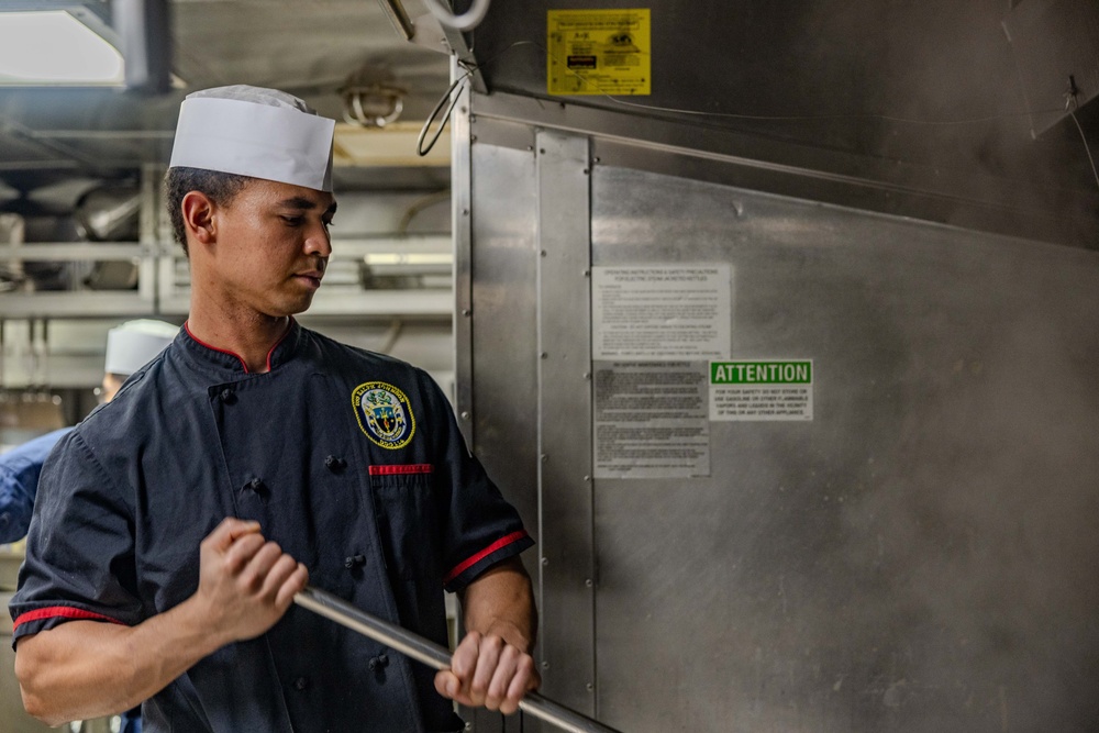 Culinary Specialists Prepare Dinner aboard USS Ralph Johnson