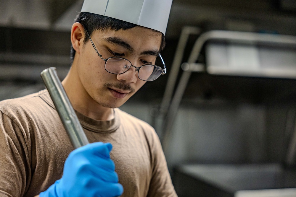 Culinary Specialists Prepare Dinner aboard USS Ralph Johnson