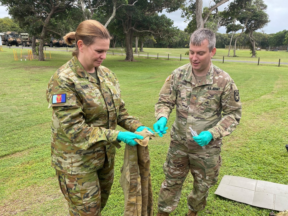 Service members swab uniforms as part of the environmental biosurveillance conducted at Talisman Sabre 2025