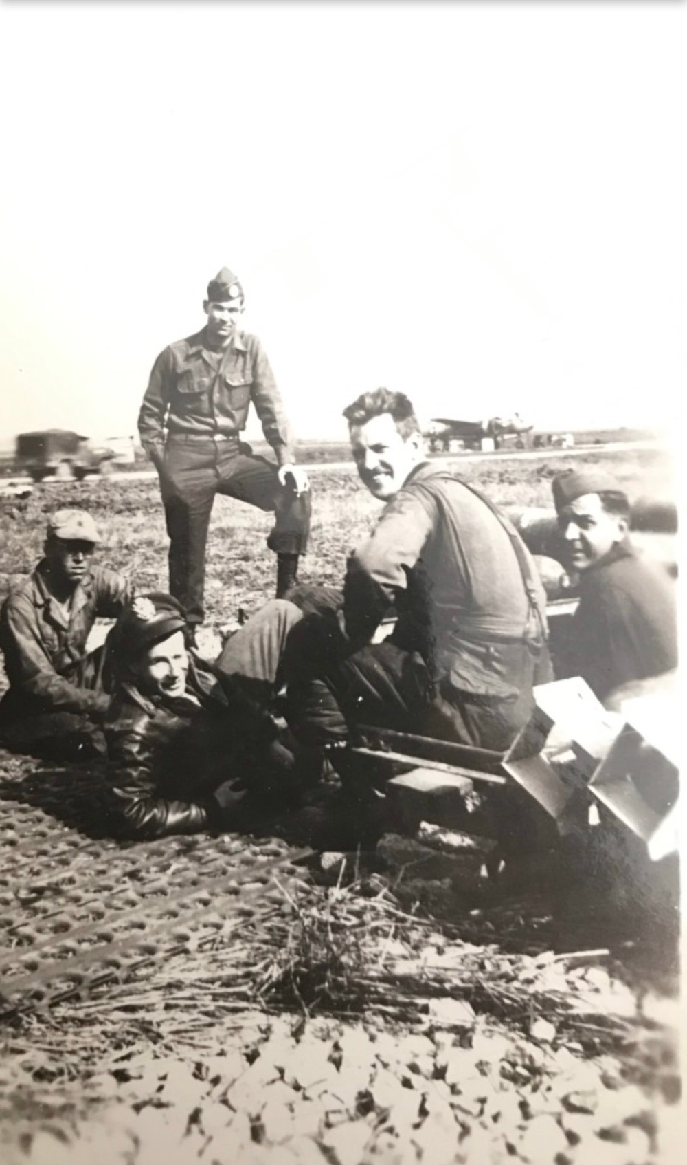Staff Sgt. Loring E. Lord gathers with members of his aircrew