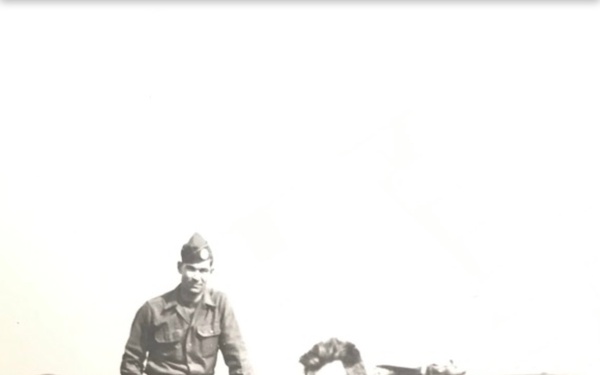 Staff Sgt. Loring E. Lord gathers with members of his aircrew