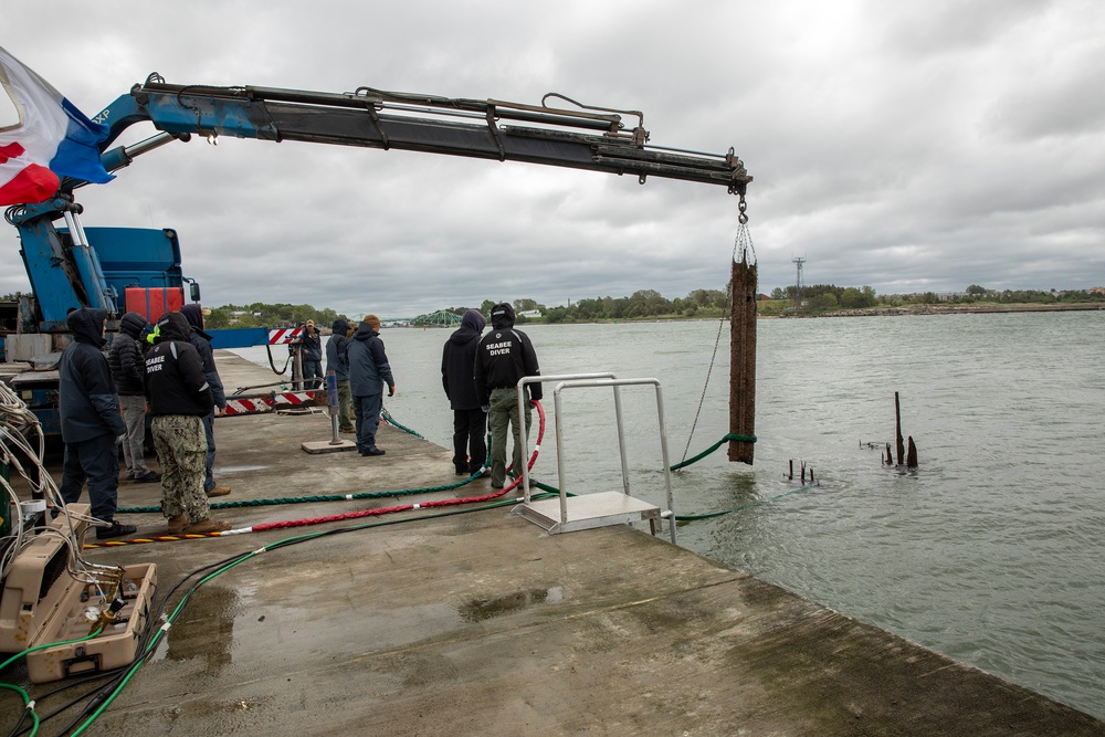 U.S. Navy Divers, Latvian Divers Remove Pylons During BALTOPS 25