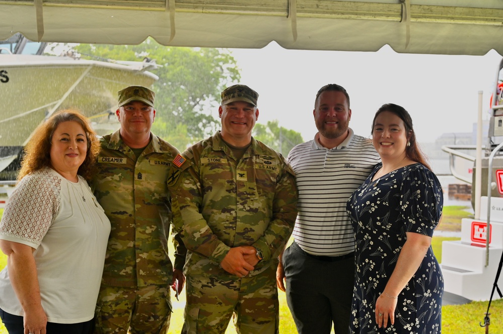 Group photo of family members with command team