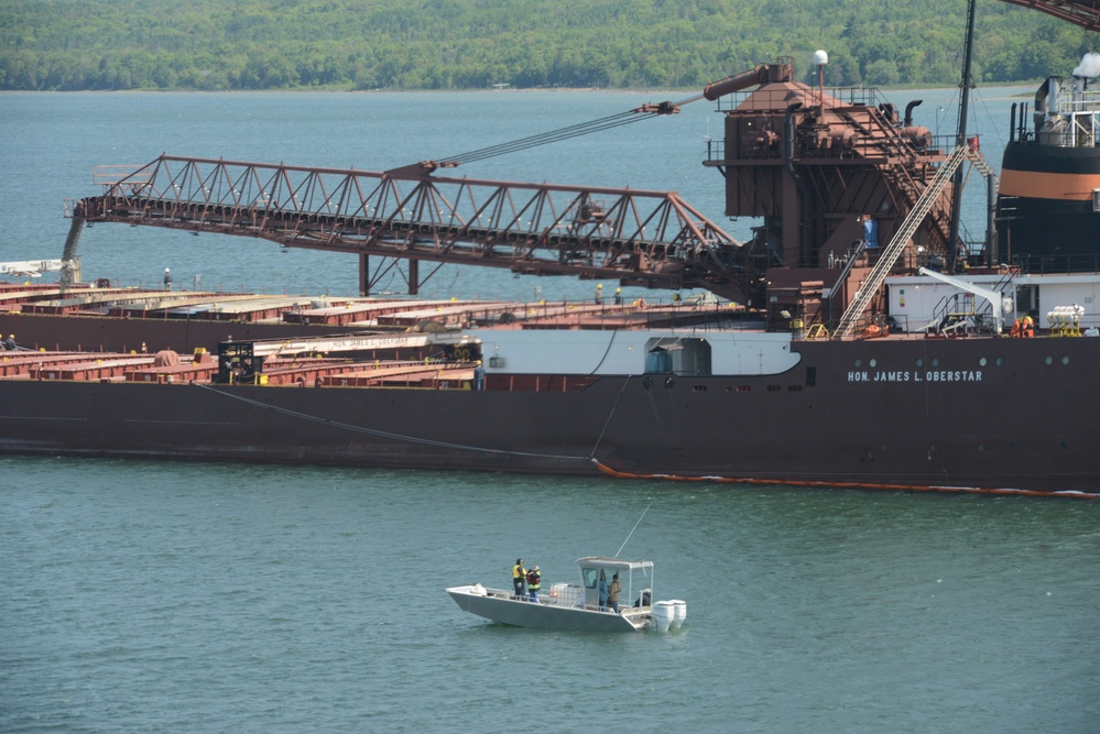 A Hay Lake Marine Casualty marine pollution mitigation team stands watch