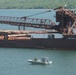 A Hay Lake Marine Casualty marine pollution mitigation team stands watch
