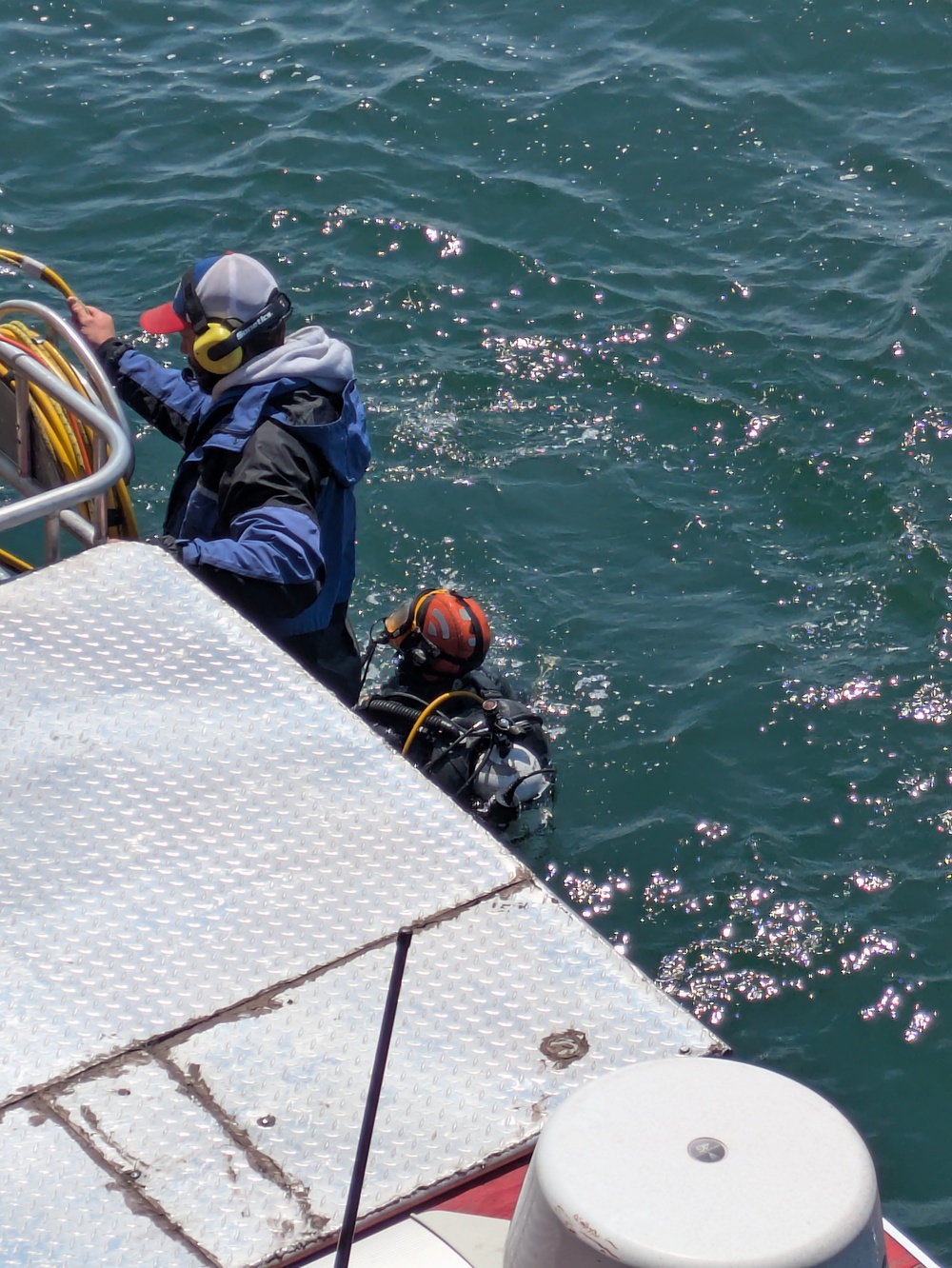 A Hay Lake Marine Casualty diver prepares to survey the hull of the M/V Hon. James L. Oberstar for damage