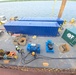Hay Lake Marine Casualty responders prepare containment tanks aboard a work barge