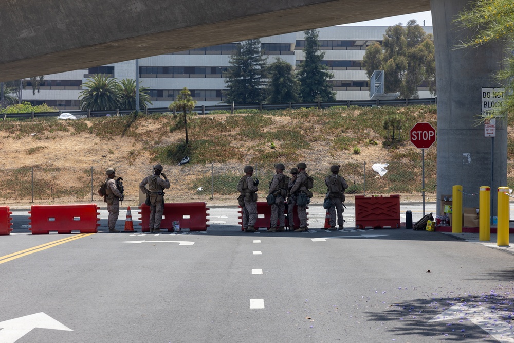 U.S. Marines, California Army National Guard stand watch at federal building