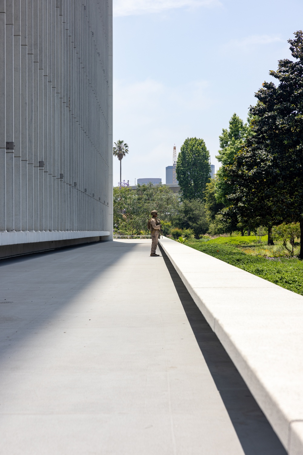 U.S. Marines, California Army National Guard stand watch at federal building