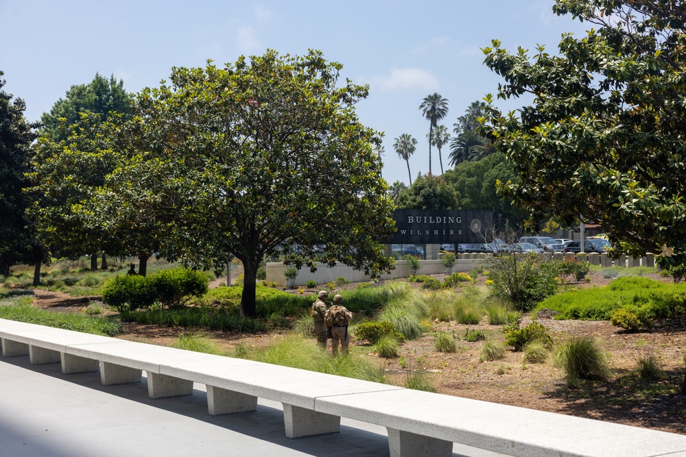 U.S. Marines, California Army National Guard stand watch at federal building