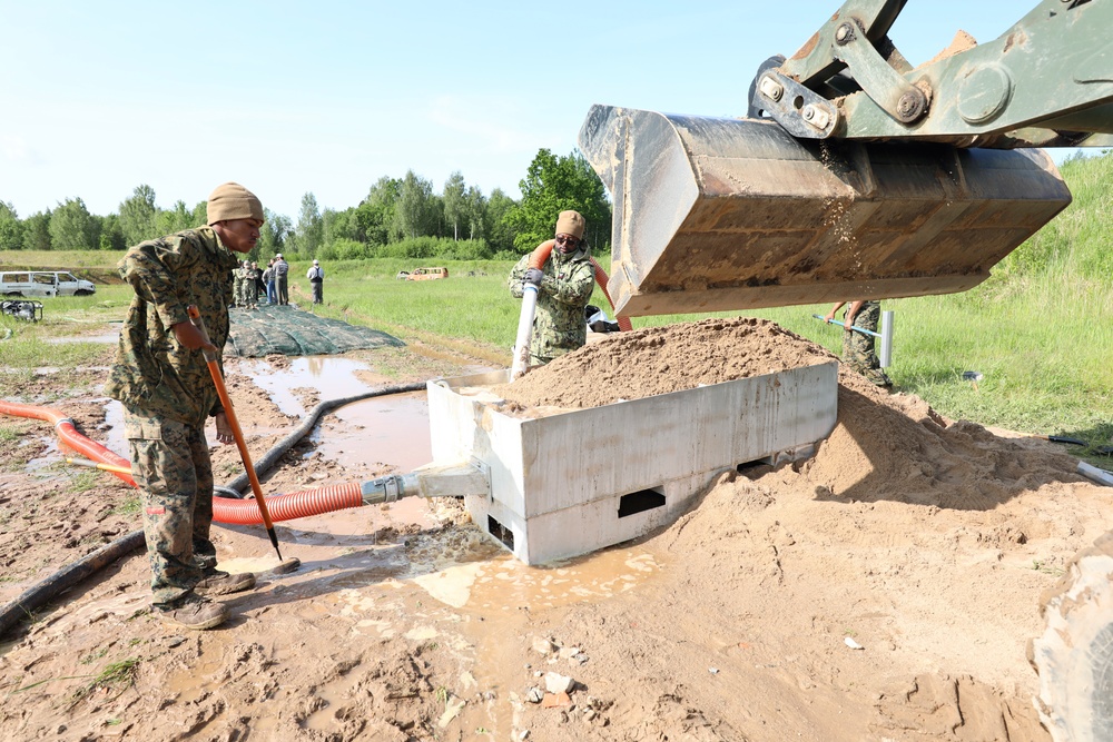U.S. and Latvian Forces Install Submatt Road System - BALTOPS 25