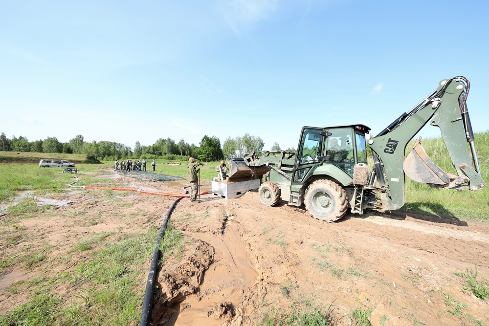 U.S. and Latvian Forces Install Submatt Road System - BALTOPS 25