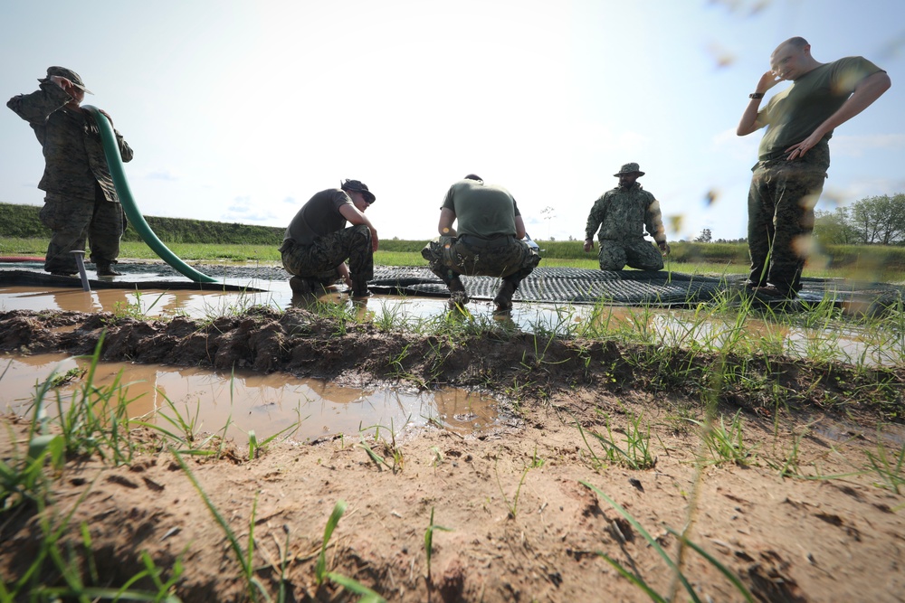 U.S. and Latvian Forces Install Submatt Road System - BALTOPS 25
