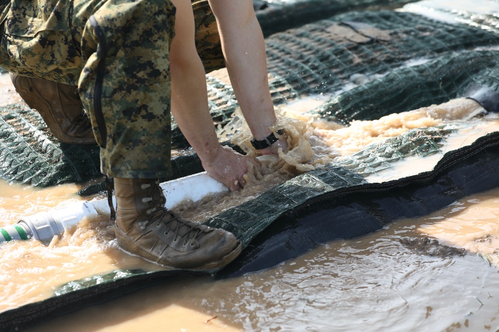 U.S. and Latvian Forces Install Submatt Road System - BALTOPS 25