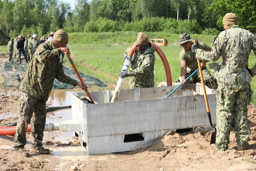 U.S. and Latvian Forces Install Submatt Road System - BALTOPS 25