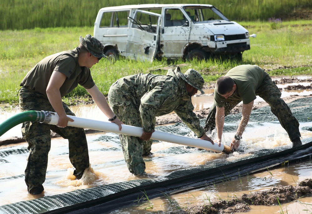 U.S. and Latvian Forces Install Submatt Road System - BALTOPS 25