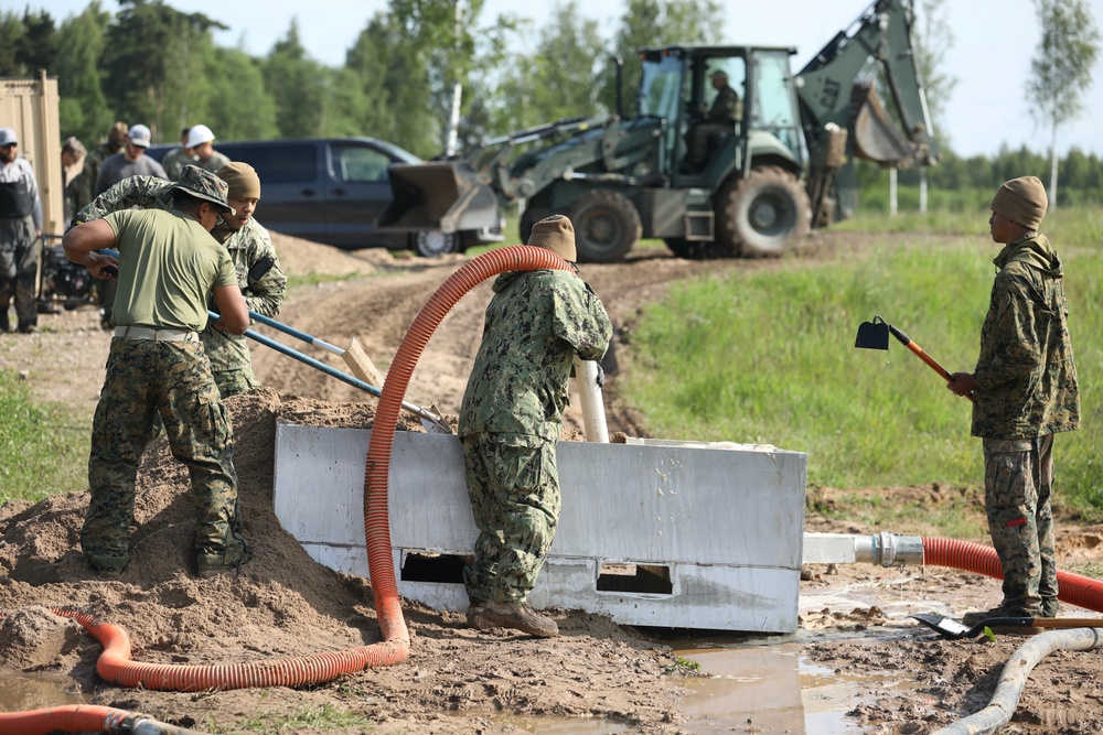 U.S. and Latvian Forces Install Submatt Road System - BALTOPS 25
