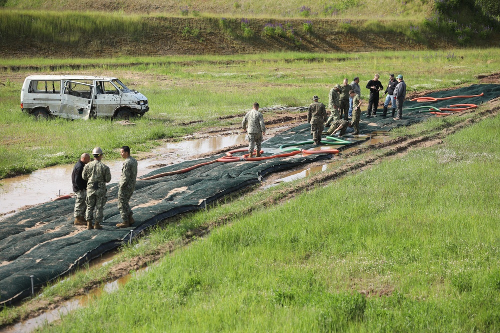 U.S. and Latvian Forces Install Submatt Road System - BALTOPS 25